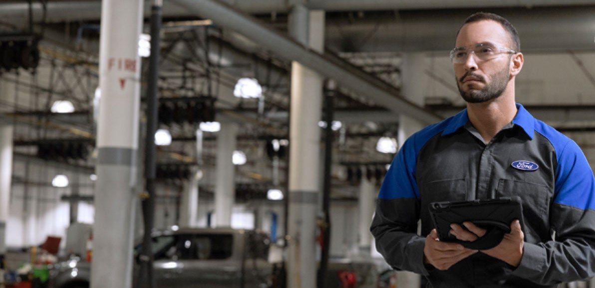 Automotive Service Technician Working on Truck