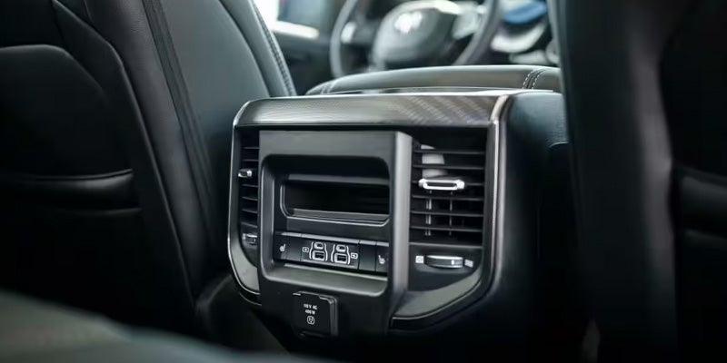 Ram 1500 Crew Cab interior with 14.5-inch Uconnect 5 touchscreen and passenger display