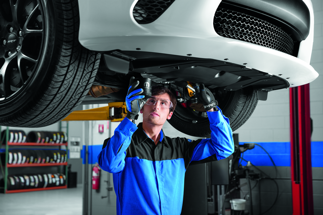 Factory Certified Technicians Performing Automotive Diagnostics