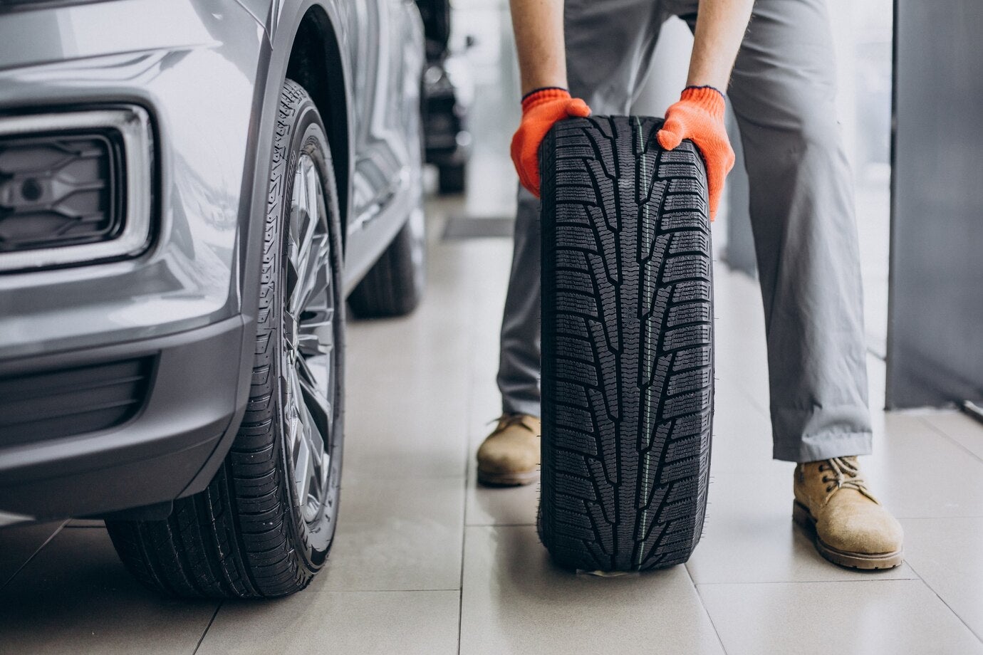 Certified technician installing snow tires and balancing wheels in Powell WY